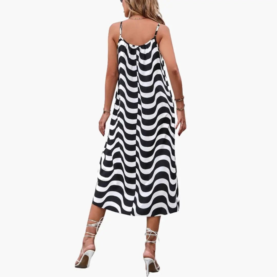 Women’s beach dress with spaghetti straps in a black-and-white wave pattern, maxi length