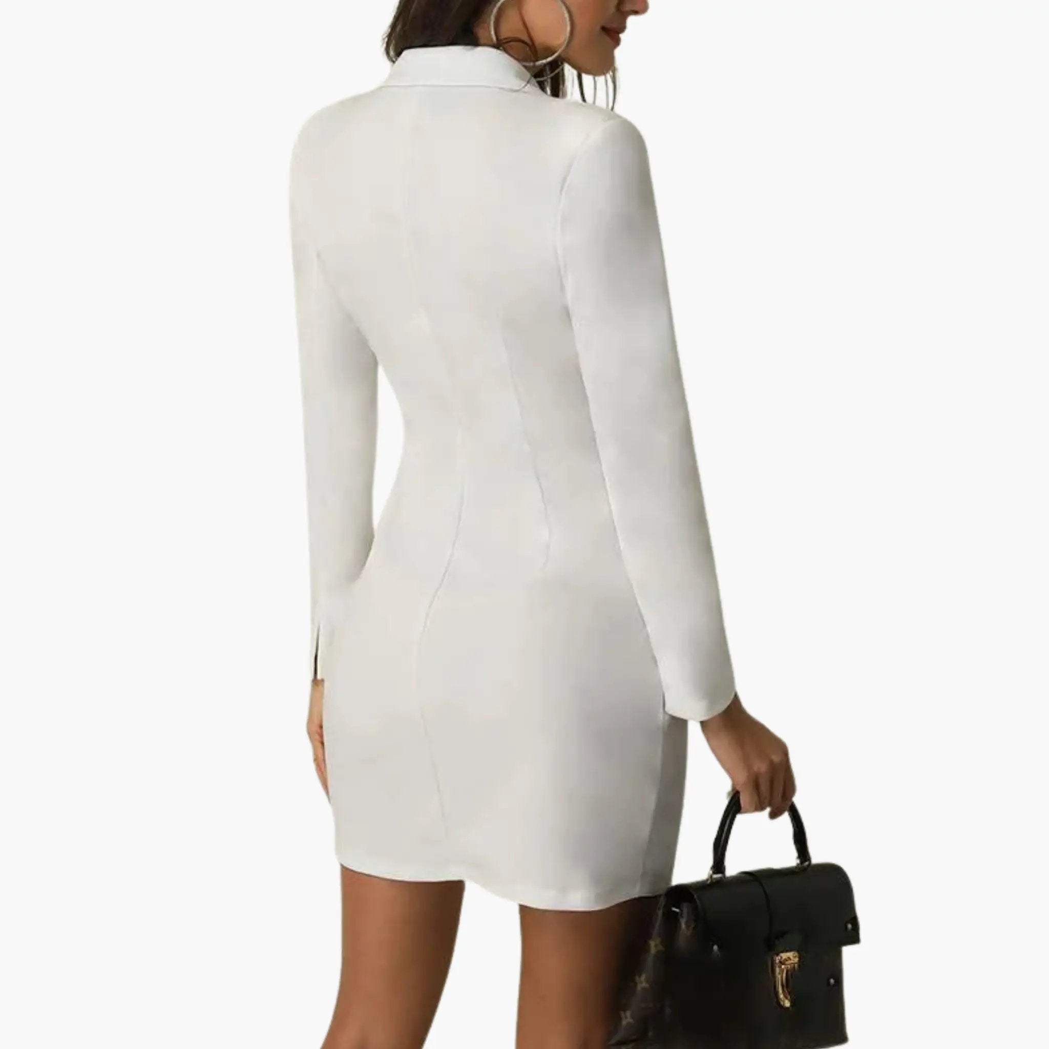White women's blazer dress back view with seam lines and above-knee length, model carries a black handbag.