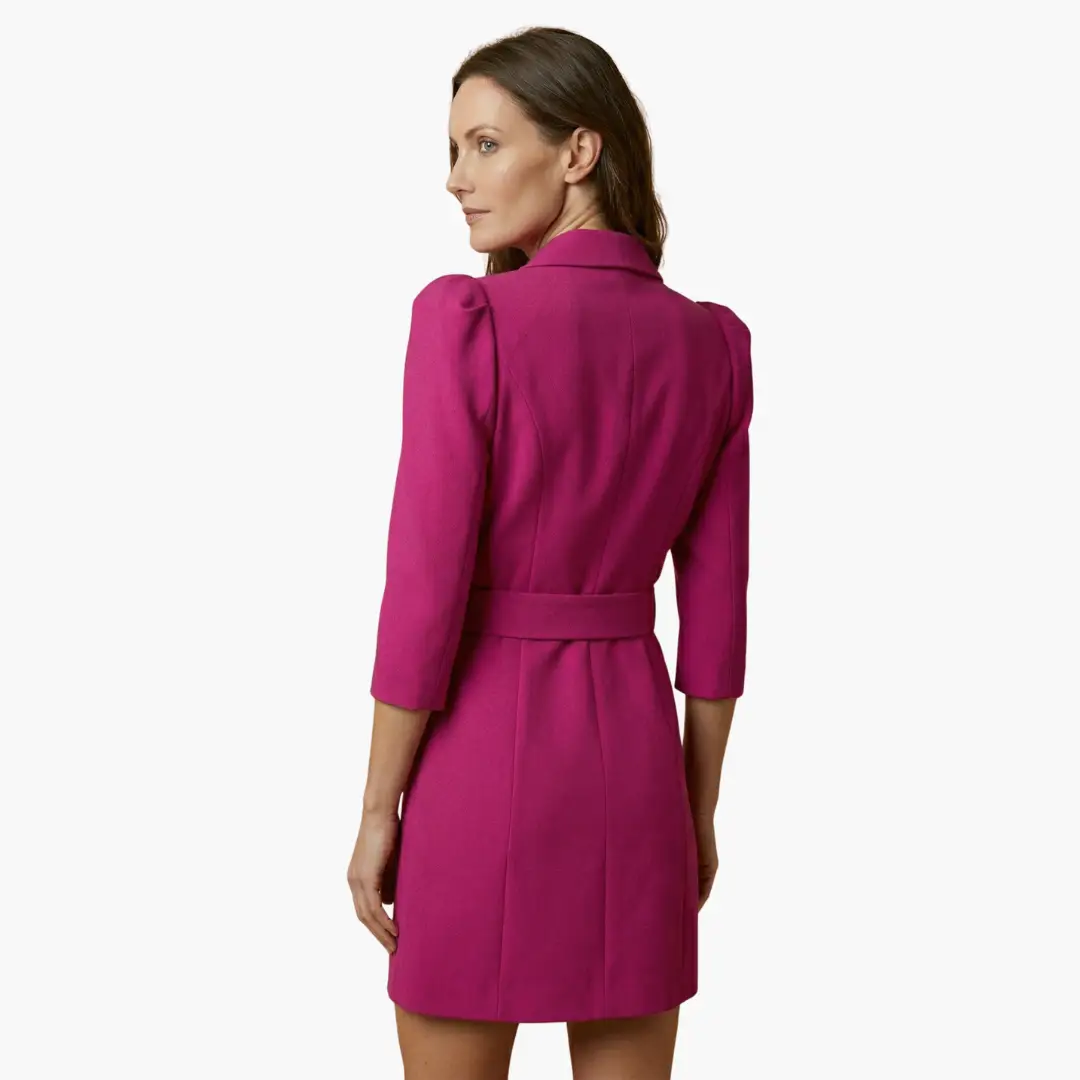 Women’s blazer dress in magenta with waist belt, back view.
