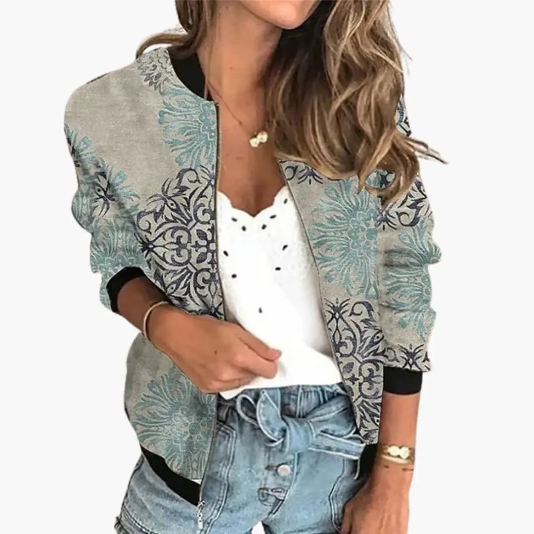 Women's bomber jacket with teal floral print on beige base by Wilfred Smith.