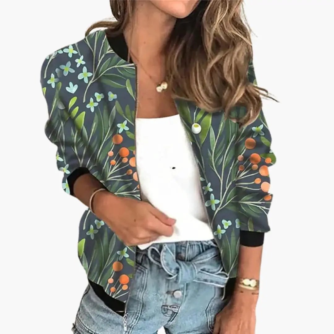 Women's bomber jacket with floral print on a dark green base, featuring leaves and orange berries.