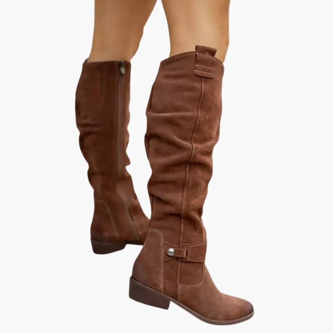 Pair of brown suede knee-high women's boots by Wilfred Smith with side zipper and low heel