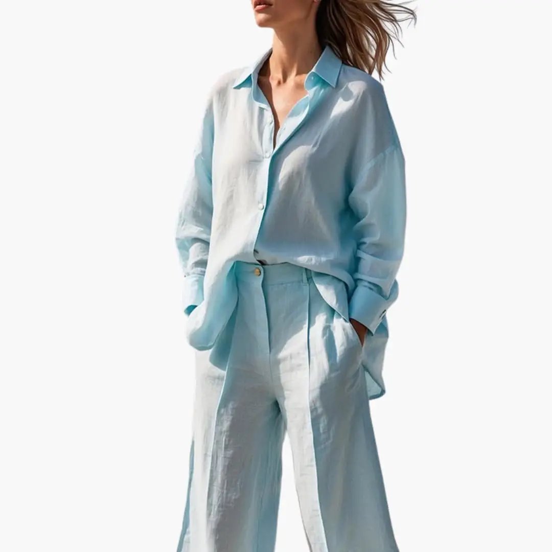 Women's two-piece set: light blue button-front shirt with matching wide-leg trousers by Wilfred Smith.