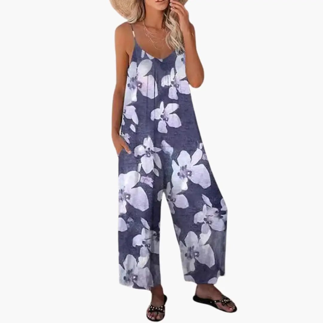 Women's one-piece jumpsuit: blue floral pattern, thin straps, wide-leg silhouette.