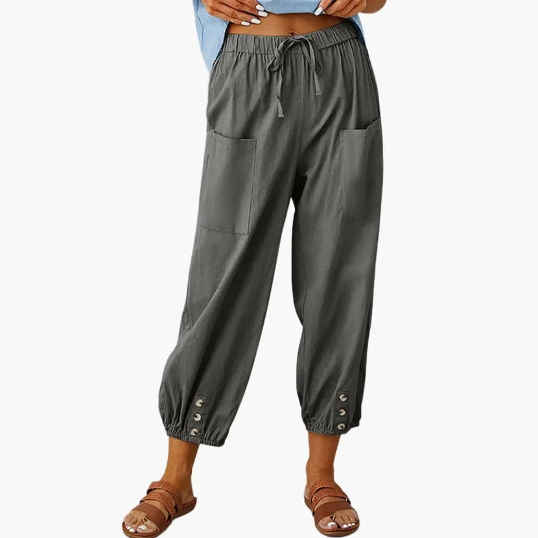 Women's casual pants with drawstring waist, side pockets, and elastic cuffs in gray.