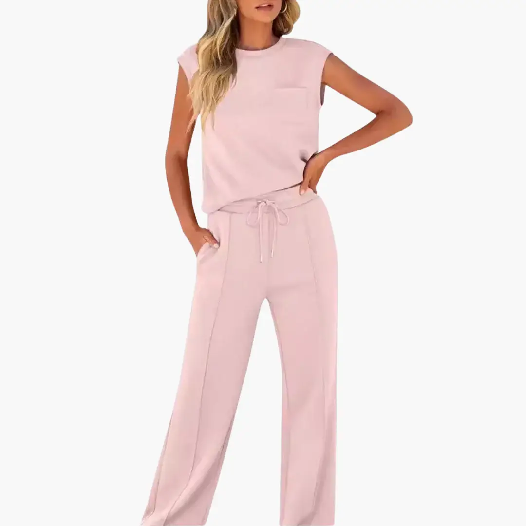 Women's Co-Ord Set in pale pink by Wilfred Smith; relaxed-fit top with chest pocket and drawstring pants with pockets.