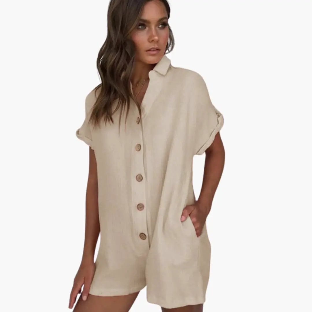 Women's Jumpsuit by Wilfred Smith in beige with collar, button-front, rolled sleeves, and side pockets.