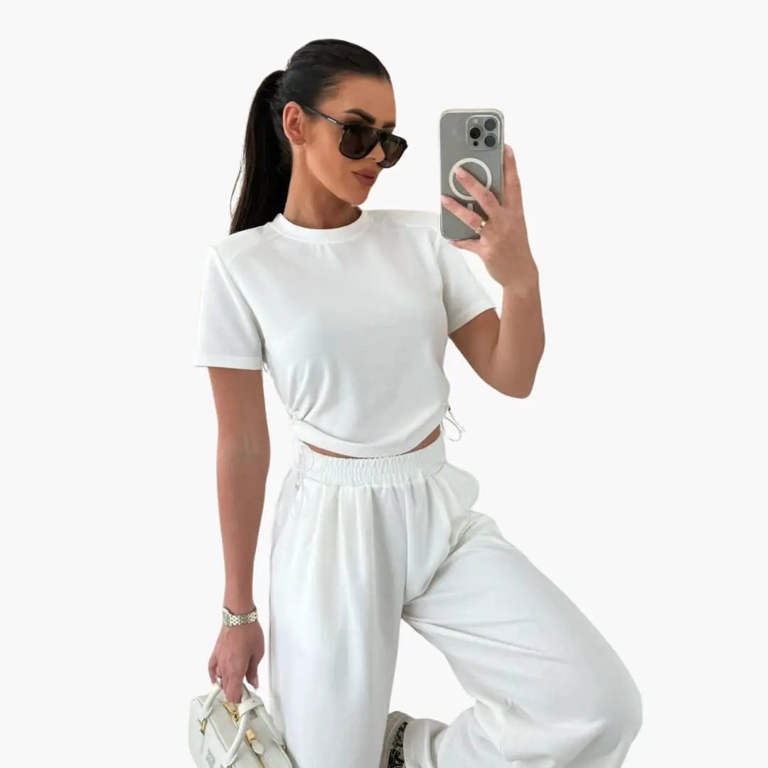 Women's crop top and jogger pants two-piece set in white with short sleeves and side-tie detail