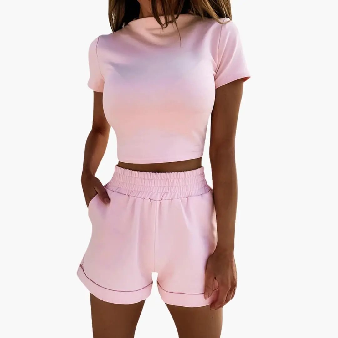 Women's crop top and shorts two-piece set in pastel pink with elastic waist