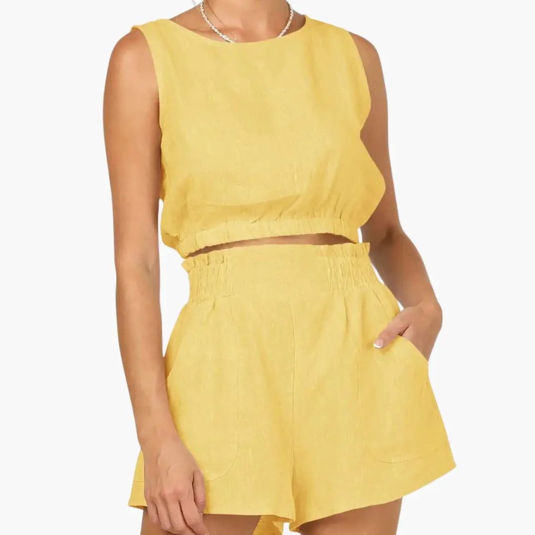 Women's yellow two-piece outfit: sleeveless drawstring-hem crop top with elastic-waist shorts