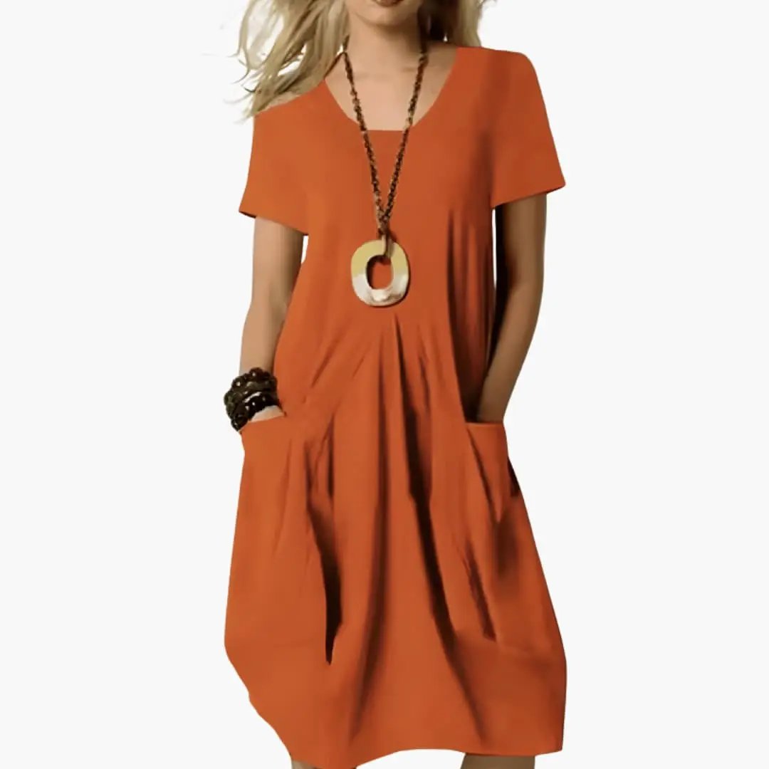 Women's orange knee-length dress with a plain woven surface, short sleeves, and side pockets