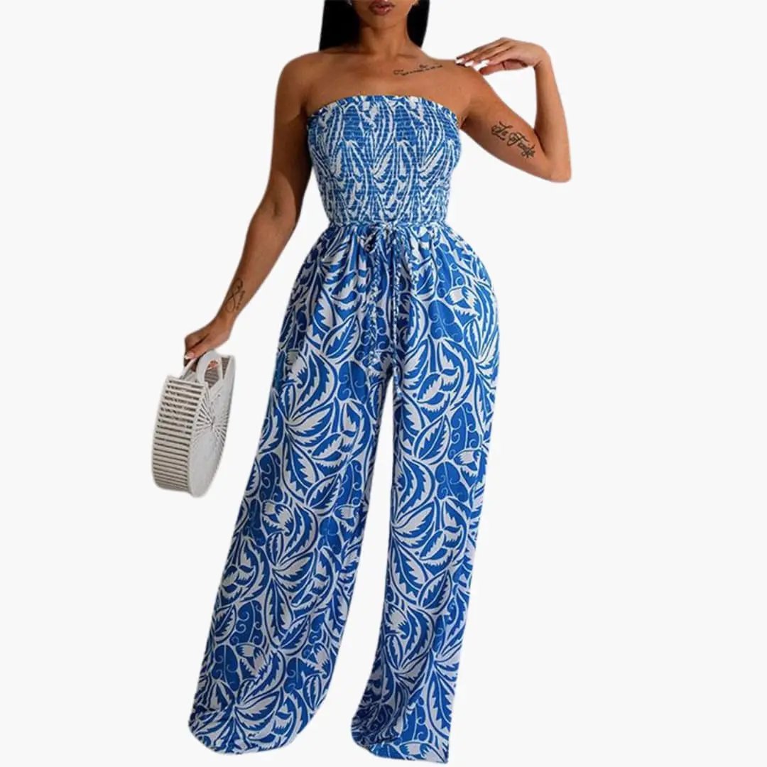 Women’s Elastic Top Wide Leg Jumpsuit in blue-white leafy print with strapless elastic bodice and waist tie.