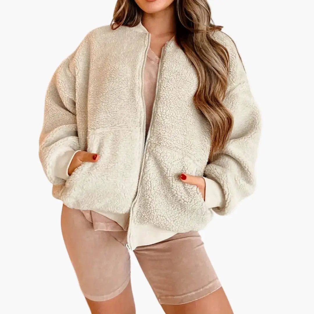 Women's fleece bomber jacket by Wilfred Smith in cream, with zipper and pockets.