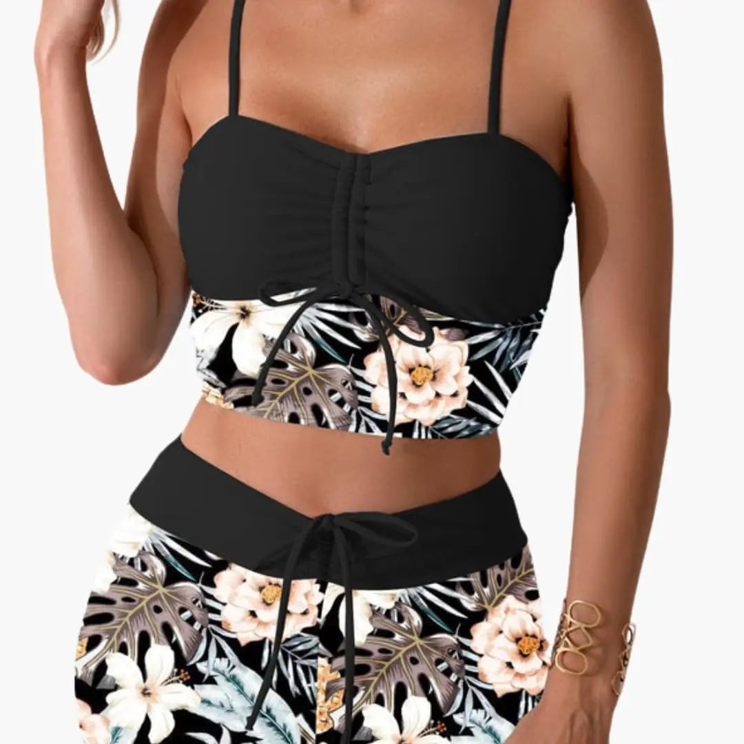 Women's bikini set: black ruched top with drawstring and floral-print high-waisted bottoms.