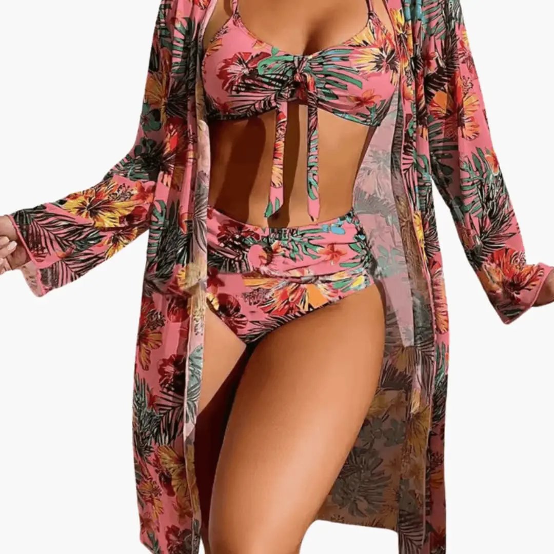 Women’s floral three-piece bikini set with matching cover-up in pink tropical print.