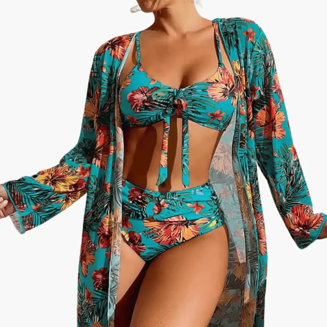 Women's floral three-piece bikini set with matching teal cover-up; tropical-print top and bottom with a sheer cover-up.