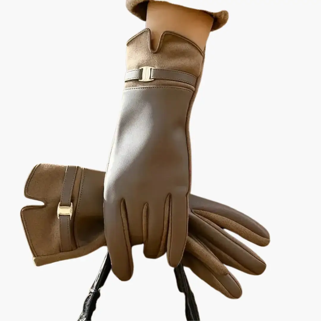 Pair of women’s full-finger gloves in tan leather with decorative buckle strap and lined interior