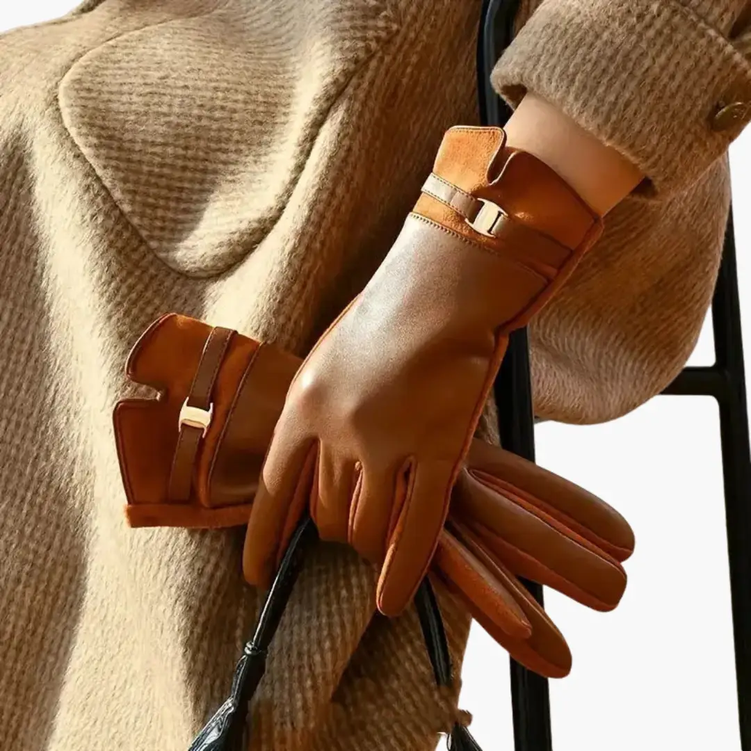 Women’s full finger leather gloves in tan brown with lined interior and decorative strap