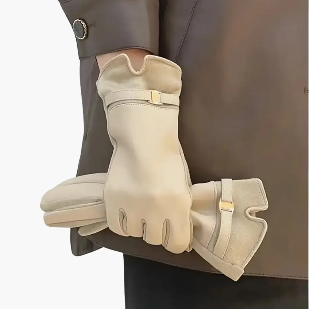 Women’s full finger gloves with lined interior and decorative strap in cream by Wilfred Smith
