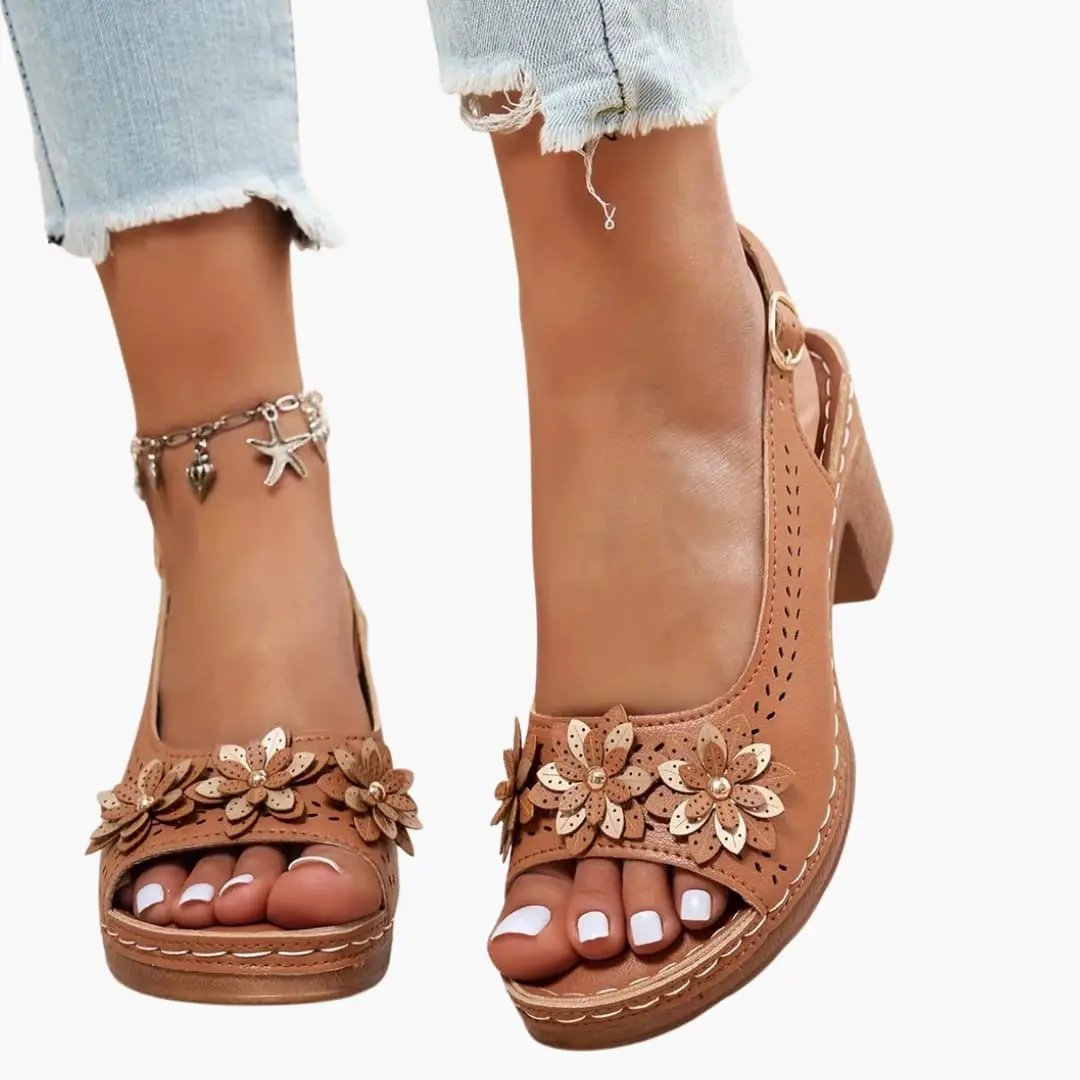 Women's heeled sandals in tan leather with ankle strap, padded insole and floral petal embellishments