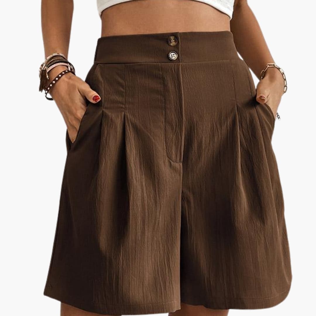 Women's high-rise wide-leg brown shorts with front button closure and side pockets.