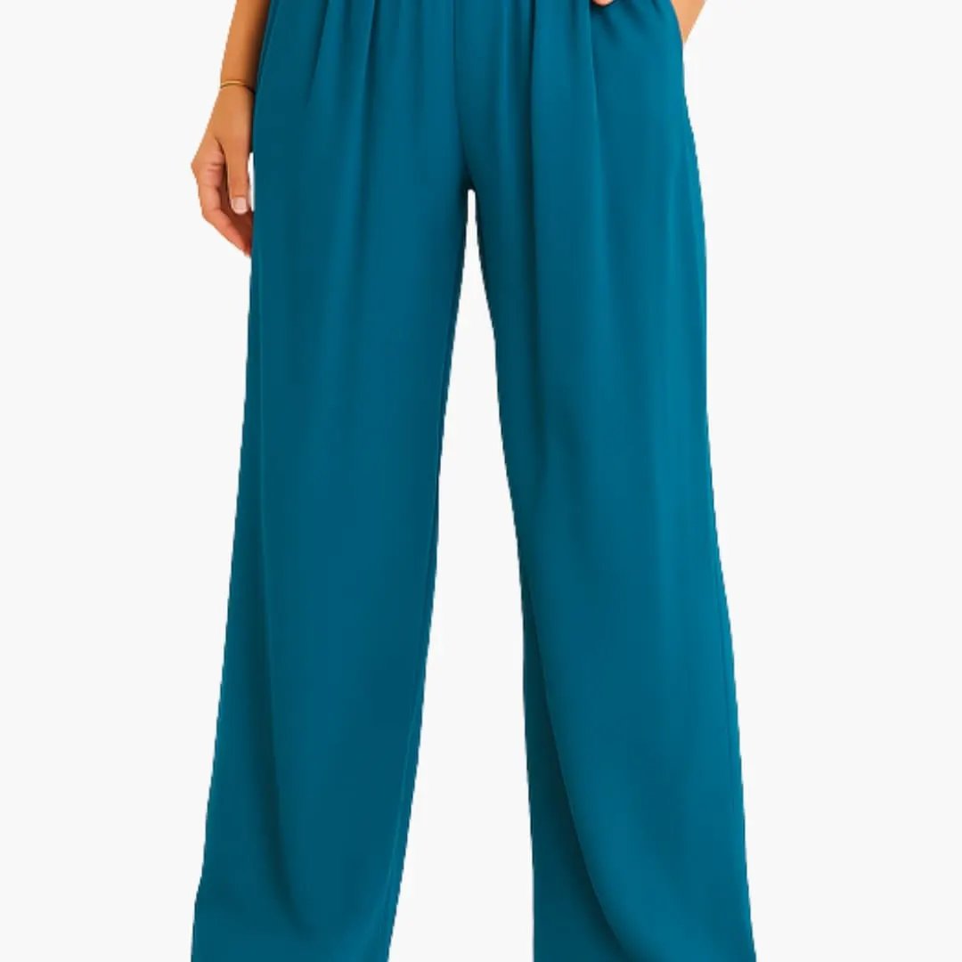 Women's high-waist pants with elastic band and teal wide-leg design.