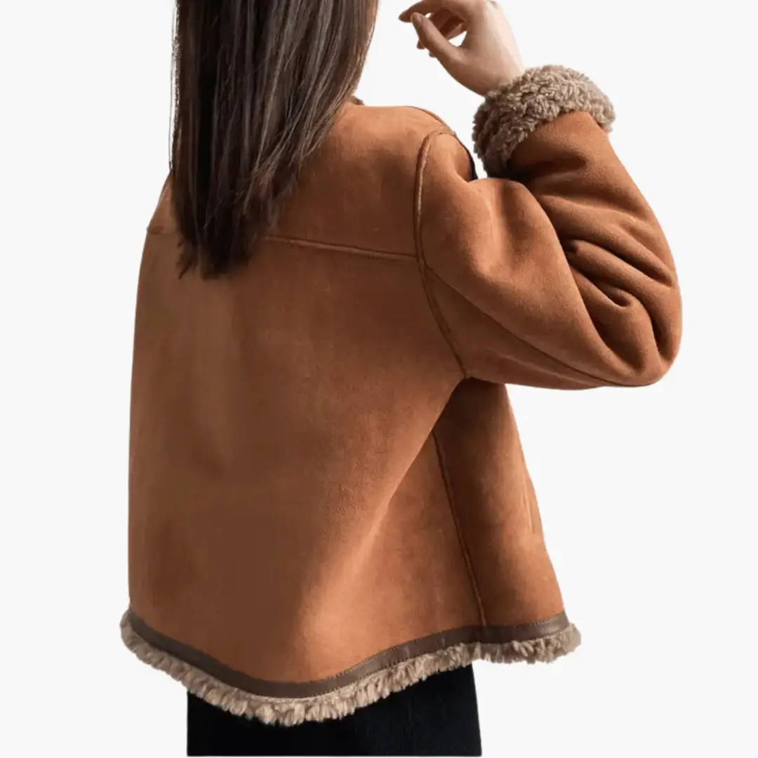 Women’s tan suede-like jacket with sherpa-style trim at cuffs and hem, short length