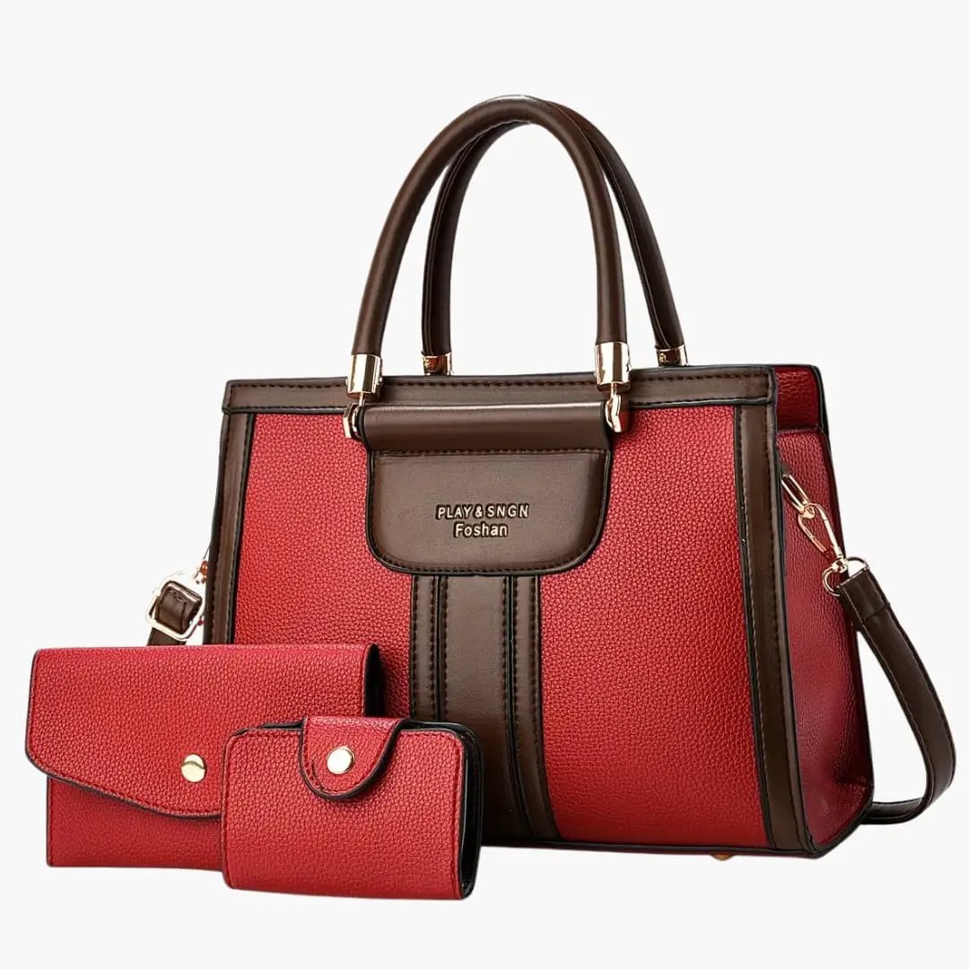 Women's Leather Shoulder Bag by Wilfred Smith with magnetic flap and adjustable strap; red-brown with two wallets.