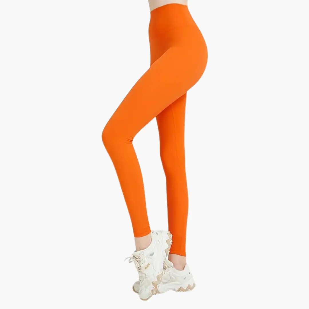 Women's high-waisted orange leggings with versatile stretch; full-length