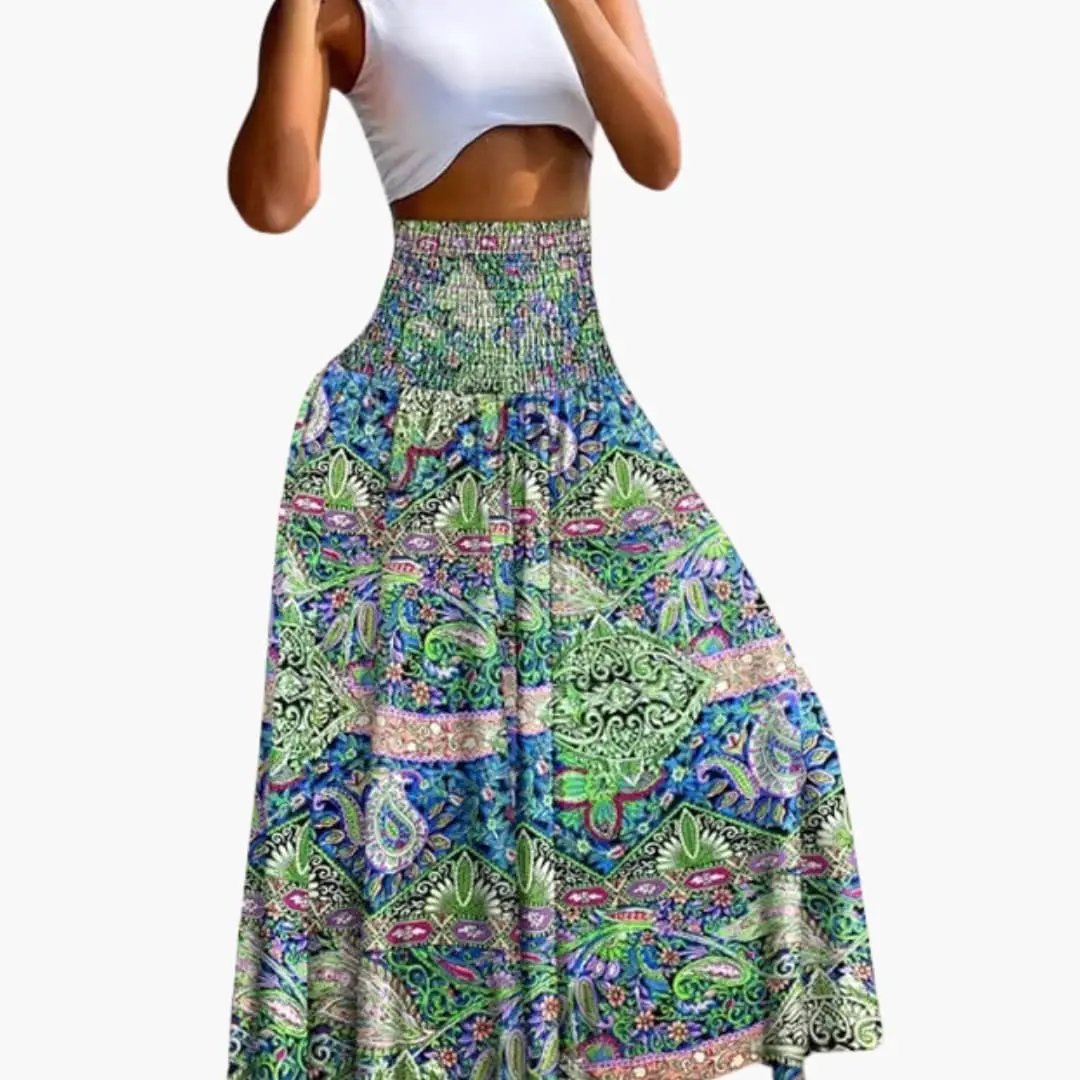 Women's long A-line skirt by Wilfred Smith with elastic waistband and side pockets in a colorful paisley print.