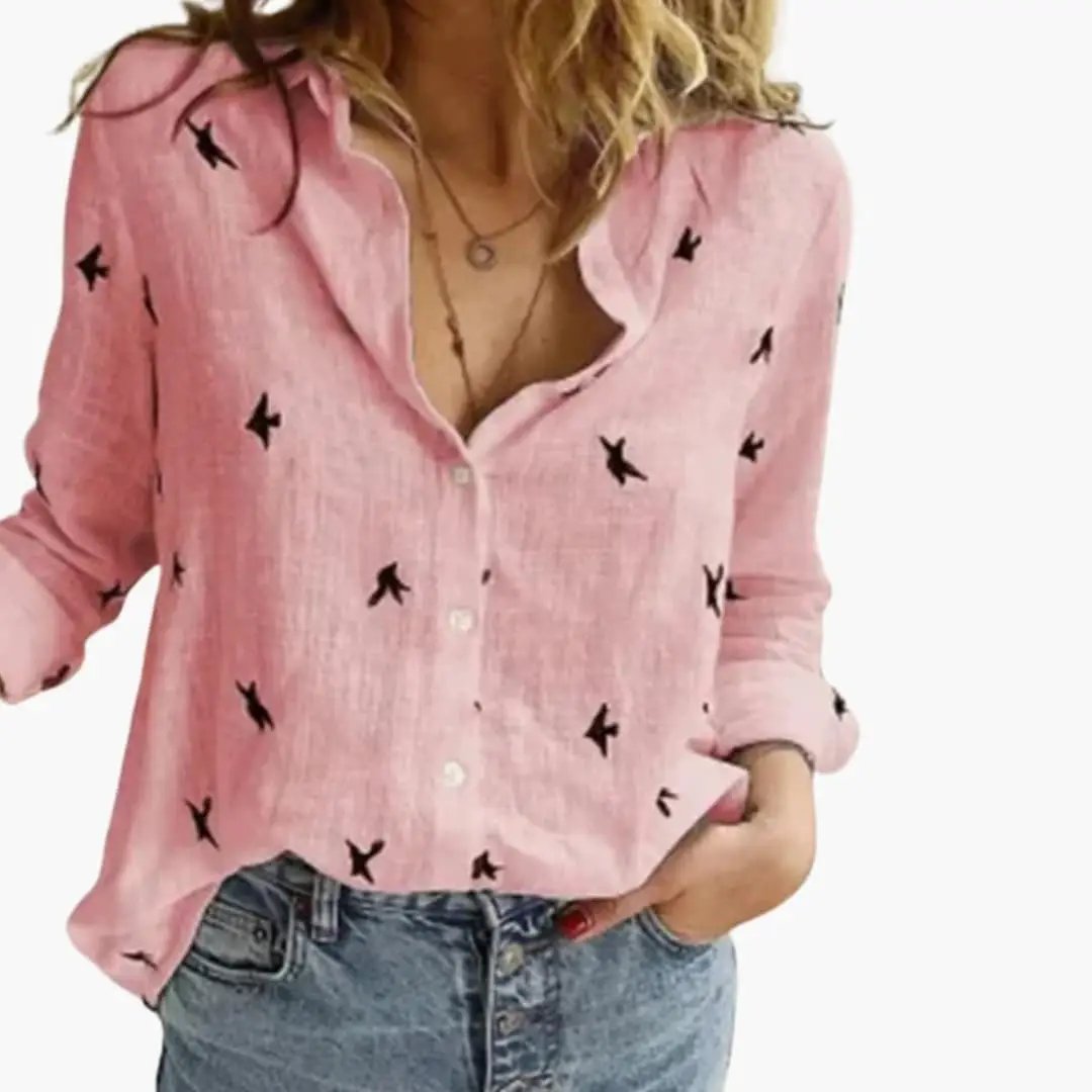 Women's pink long-sleeve blouse with black bird print and button-front closure; relaxed fit