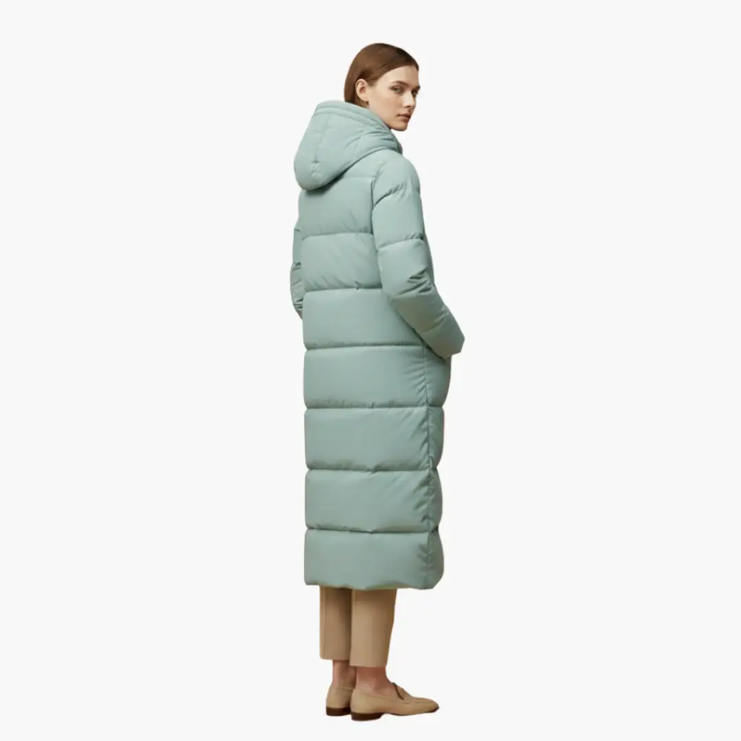 Women's long mint green puffer coat with hood and button closure.