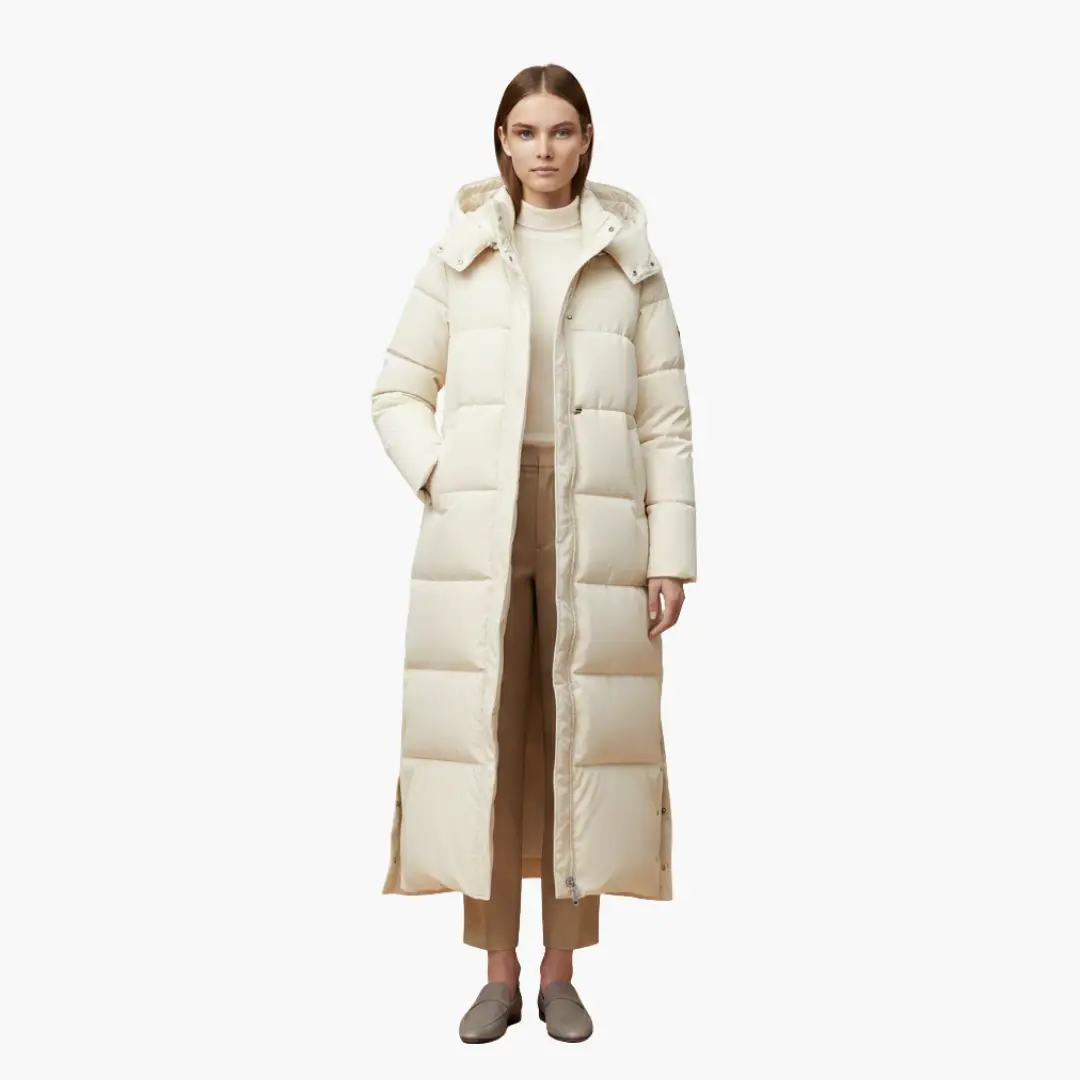 Women's long ivory puffer coat with hood, quilted panels and button closure.