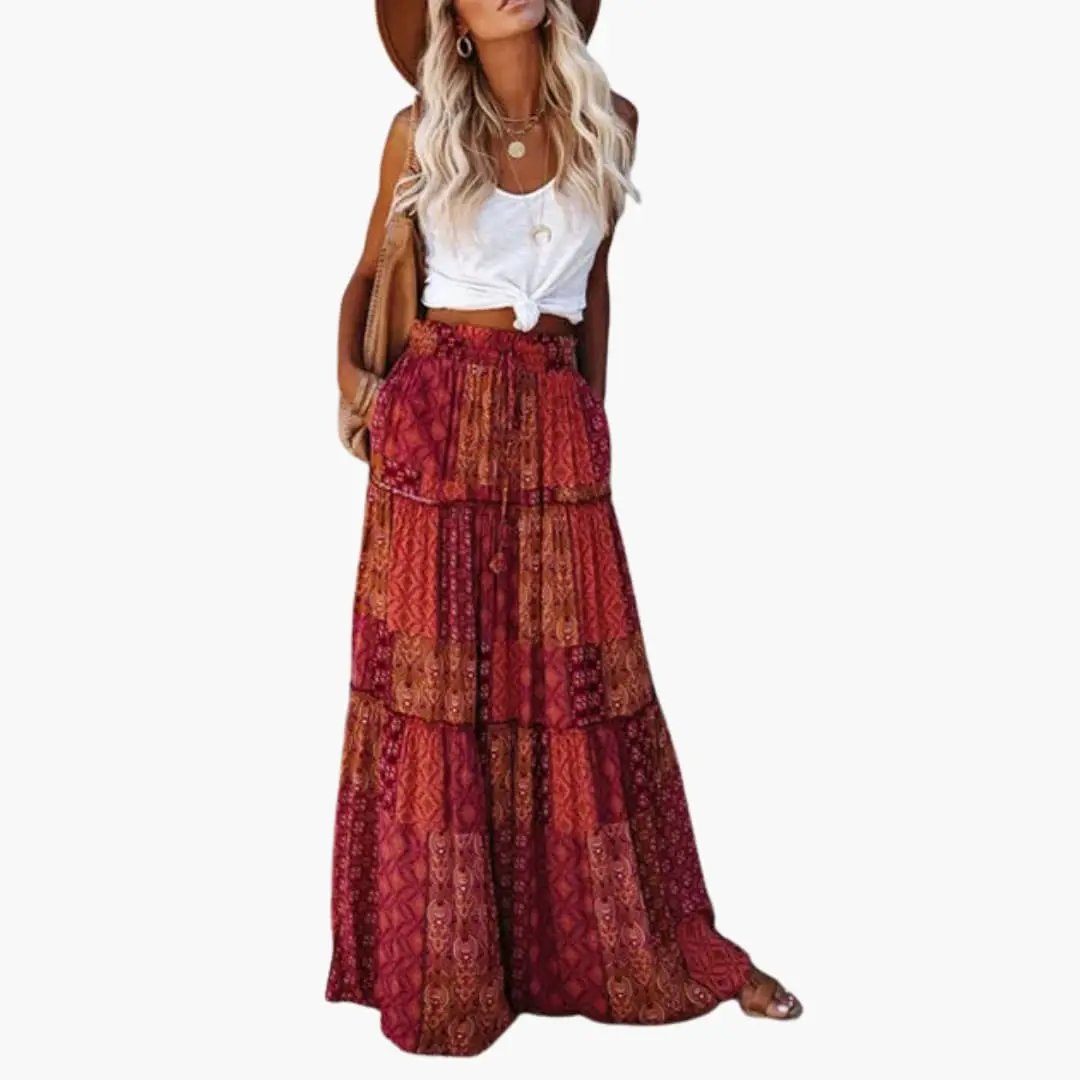 Women's maxi skirt with elastic waistband in red patchwork print, tiered design.