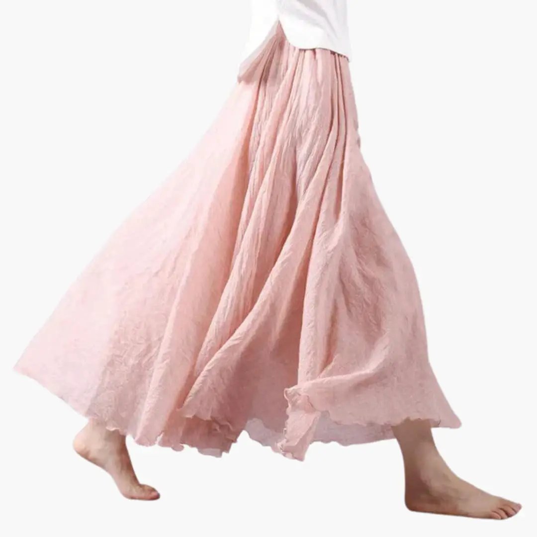 Women's pink maxi skirt with elastic waistband, flowing silhouette, straight hem.
