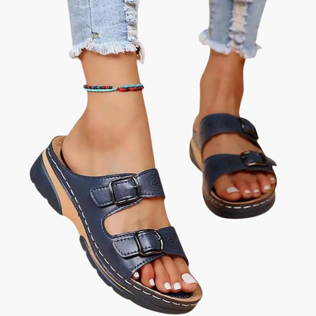 Women's orthopedic sandals by Wilfred Smith in navy blue with two adjustable straps and wedge sole