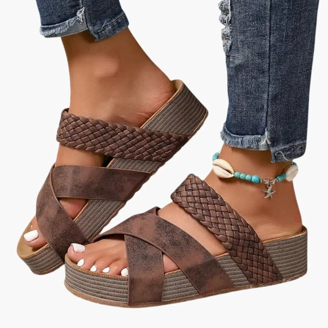 Women's orthopedic sandals with contoured sole and slip-on design; brown braided straps on a wedge platform.