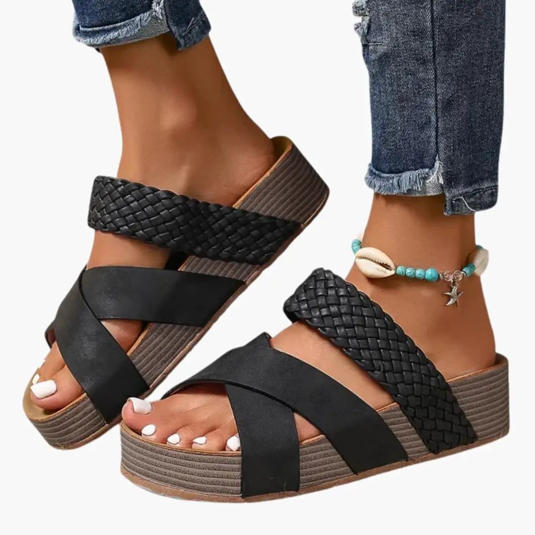 Women's orthopedic sandals with contoured platform sole and slip-on design, black braided straps