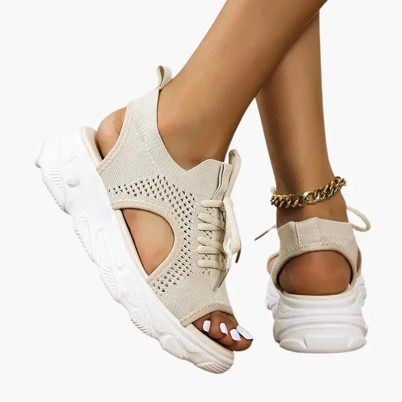 Pair of women's orthopedic sandals with cushioned footbed, beige knit upper and adjustable straps