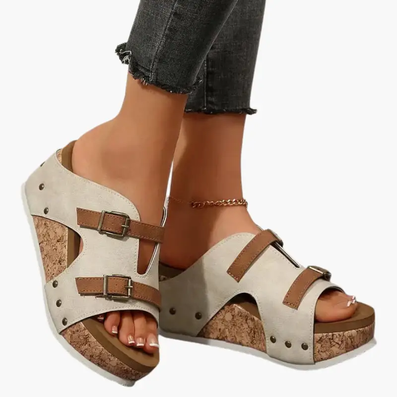 Women's orthopedic sandals by Wilfred Smith with cork wedge sole and tan adjustable straps.