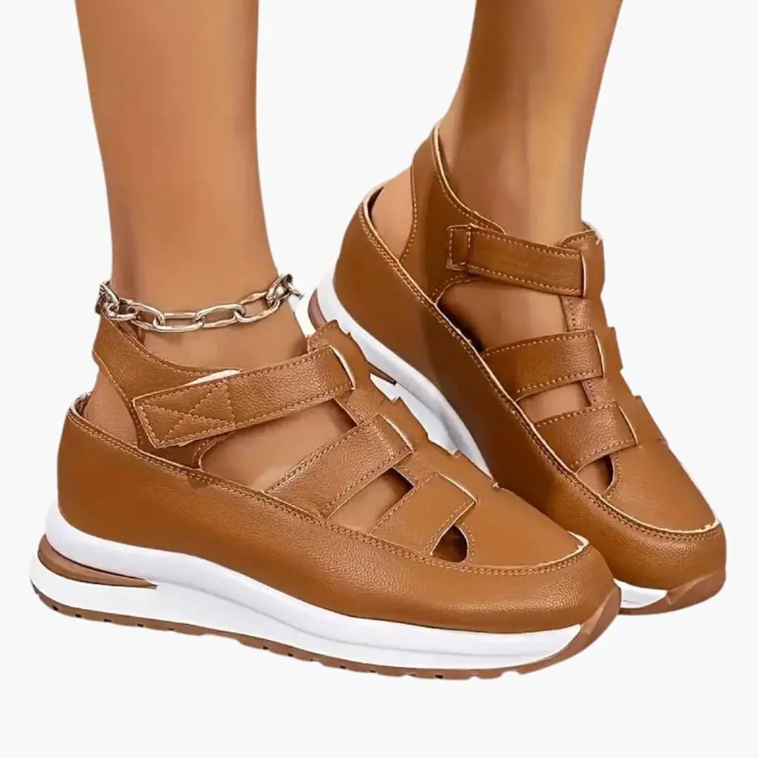 Women's orthopedic sandals by Wilfred Smith with adjustable straps and textured sole in tan leather.