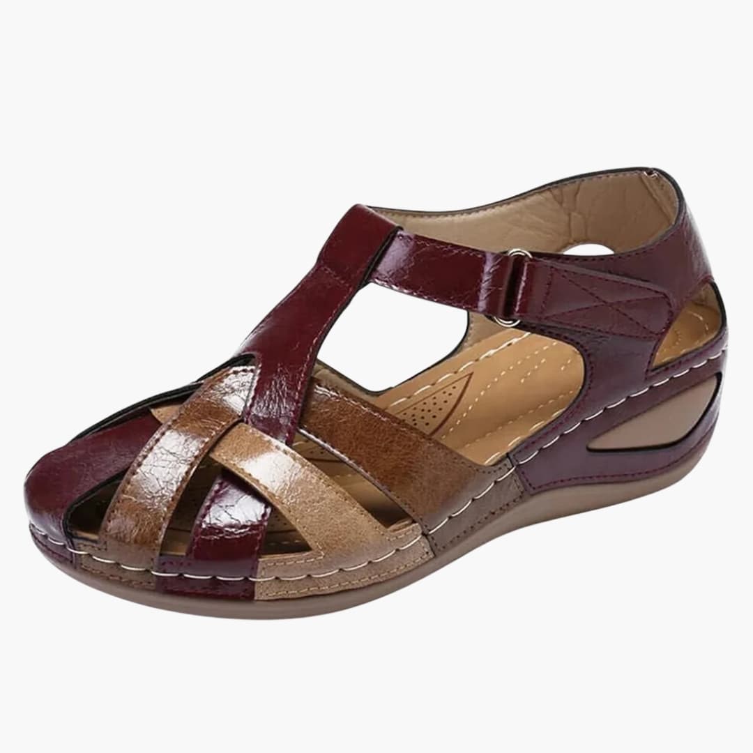 Women's orthopedic sandals by Wilfred Smith with buckle straps and wedge sole in burgundy and tan leather
