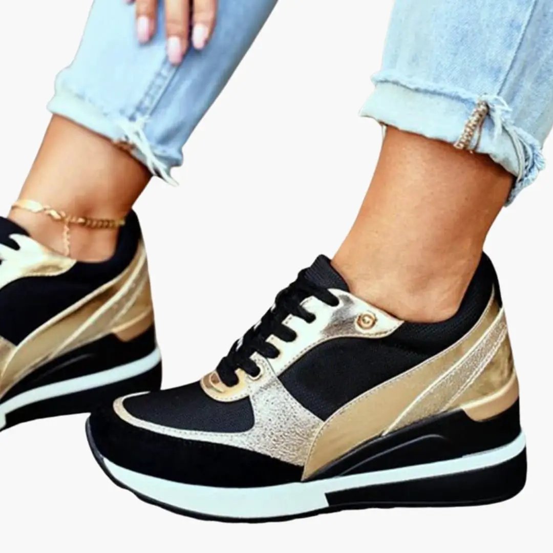 Pair of women's orthopedic sneakers with cushioned lift-insole, black and metallic gold upper