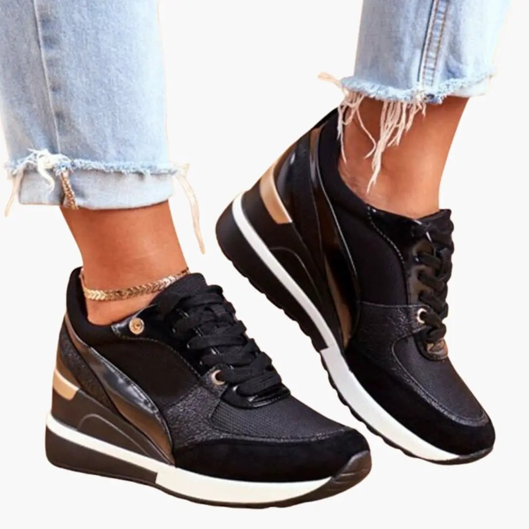 Pair of Women's orthopedic sneakers by Wilfred Smith with cushioned lift insole, black with brown accents