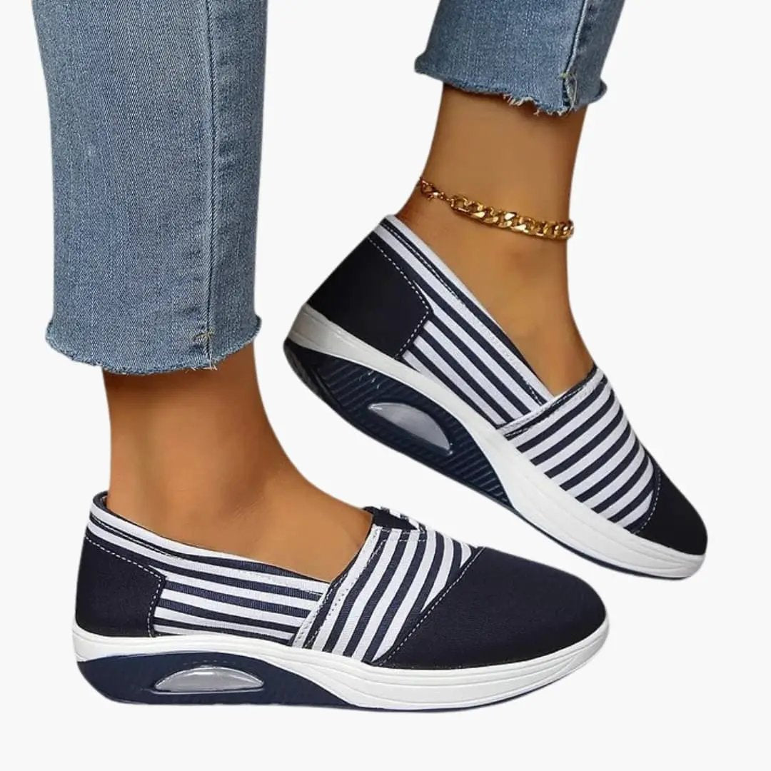 Women's orthopedic slip-on sneakers with navy and white stripes and textured sole