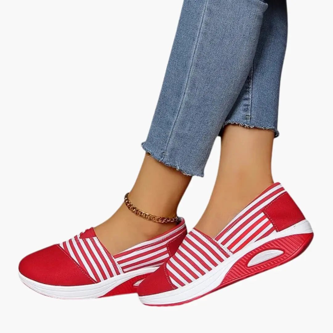 Women's orthopedic slip-on sneakers by Wilfred Smith in red and white striped pattern with a textured sole