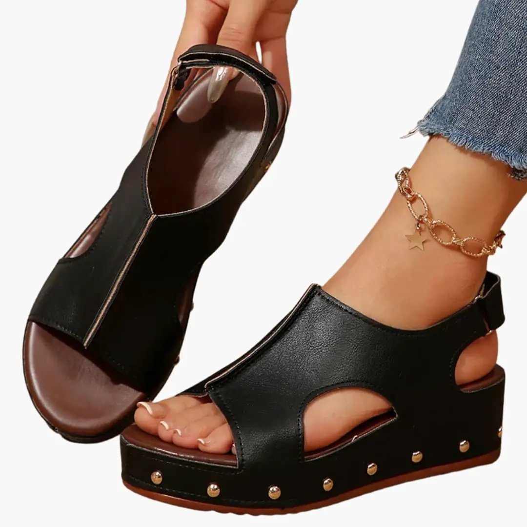 Women's platform sandals by Wilfred Smith in black with cushioned footbed and ankle strap
