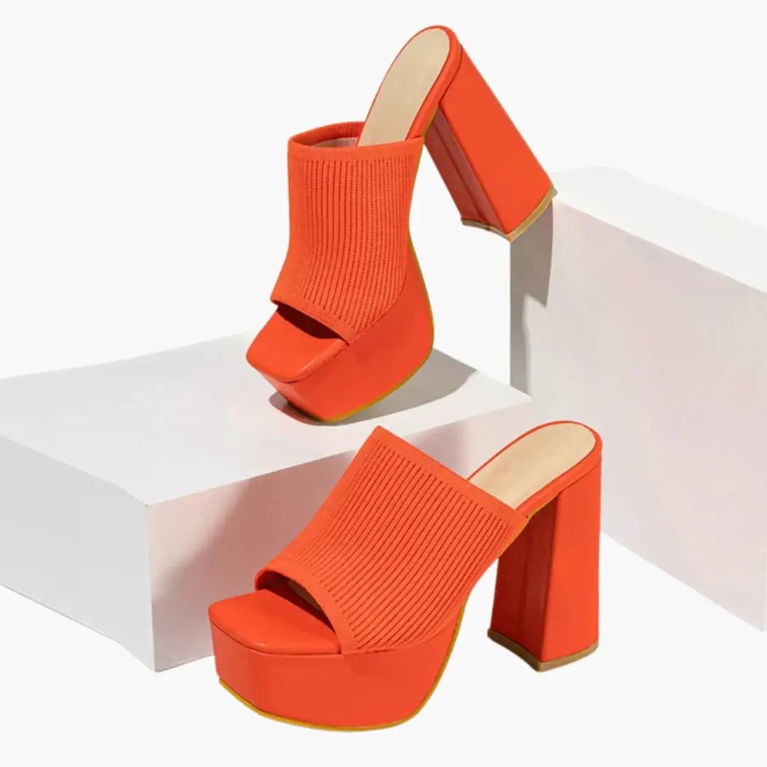Women's orange platform sandals with knit upper, cushioned insole, and chunky heel