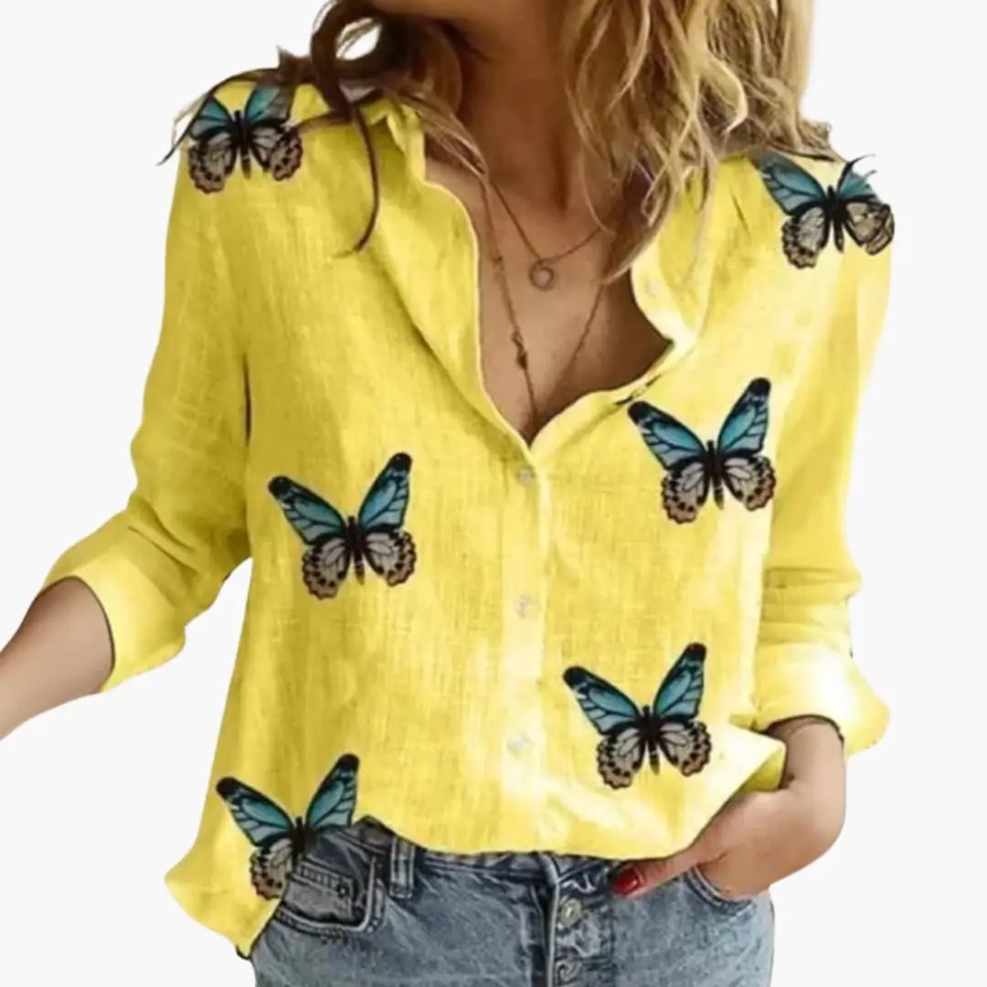 Women’s yellow long-sleeve woven blouse with blue butterfly prints and button-front.
