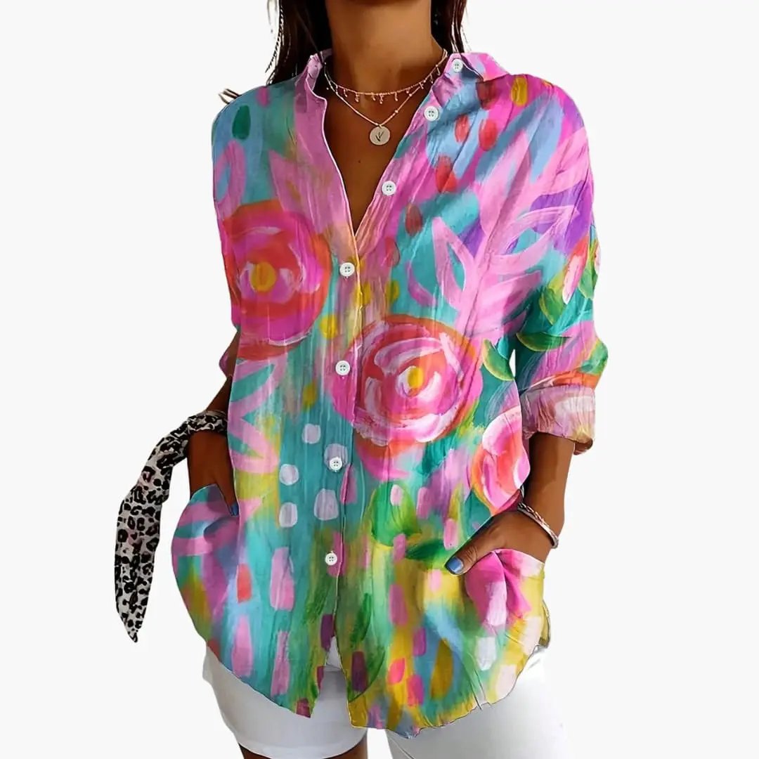 Women’s Printed Blouse multicolor floral pattern, loose fit with rolled sleeves and button-down front.